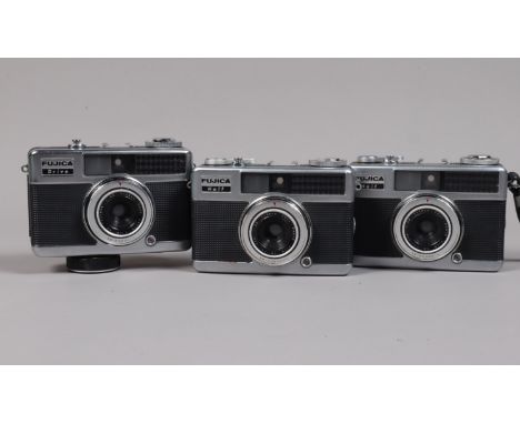 Three Fujica Half Frame Cameras, two Fujica Half's, bodies G-VG, shutters working, one with responsive meter &amp; self timer