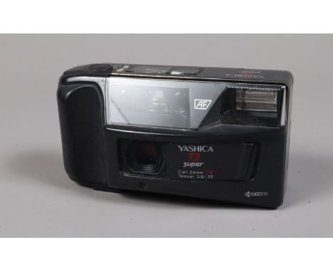 A Yashica T3 Super Compact Camera, body G, crack to display screen, light scratches, powers up, shutter working, flash workin