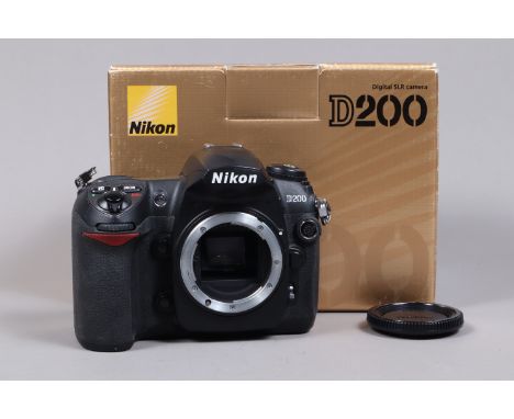 A Nikon D200 DSLR Camera Body, powers up, shutter working, body G, with charger, battery, strap, manual, in maker's box 