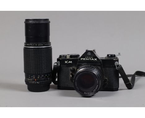 An Asahi Pentax KM SLR Camera, black, serial no 8363541, shutter working, meter responsive, body G, with SMC Pentax 55mm f/1.