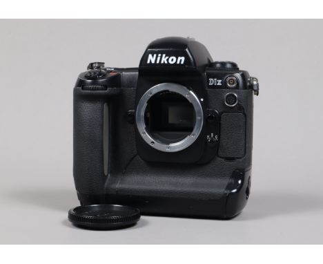 A Nikon D1x DSLR Camera Body, serial no 5175205, body G, scratches to base, wear to edges, with body cap, battery and charger