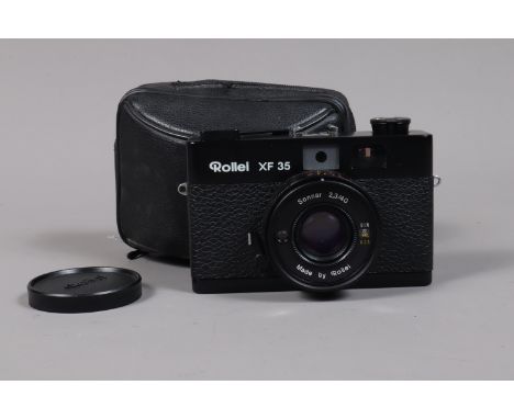 A Black Rollei XF 35 Compact Rangefinder Camera made in Singapore, body G, shutter working, rangefinder working, meter reacts