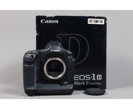 A Canon EOS-1D Mark II DSLR Camera Body, serial no 245666, body G, light wear, with body cap, strap, AC adapter, DC coupler, 