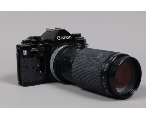 A Canon A 1 SLR Camera, shutter working, meter responsive, self timer working, body F-G, battery door missing, some brassing 