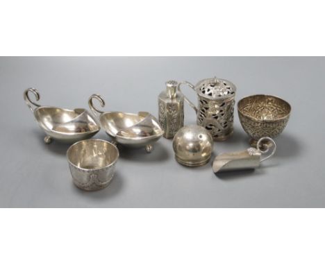A pair of George V silver salts, a Chinese white metal mustard pot pierced with dragon and clouds, 6.5cm, a pepperette, a cad