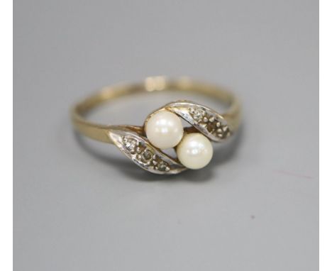 A 9ct gold seed pearl and diamond chip dress ring, size N