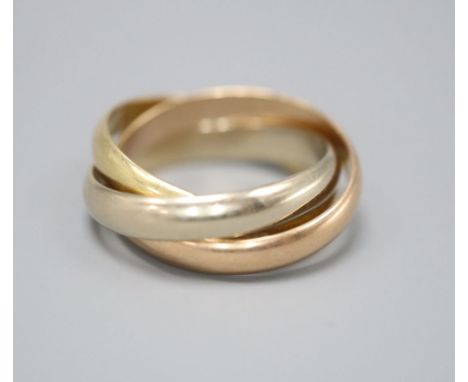 A Must de Cartier three colour 18ct gold 'Russian' triple band wedding ring, numbered 0 6373 L, size M, 8.3 grams