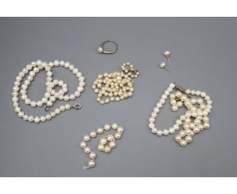 A graduated cultured pearl necklace, 47cm, a single strand pearl necklace, 39cm, a bracelet, another necklace and a dress rin