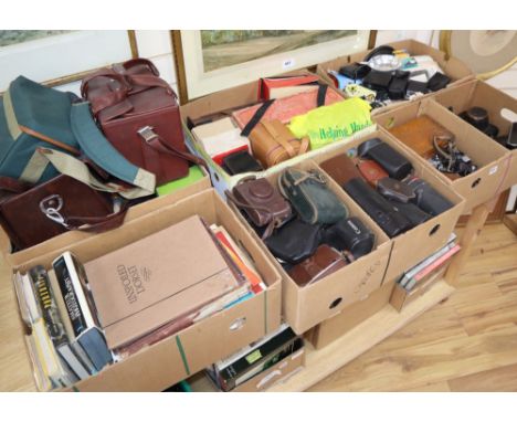 A collection cameras, camera equipment and photography books