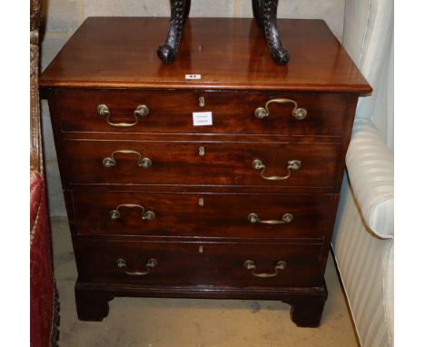 A George III mahogany commode, enclosed by a two section dummy drawer front, W.69cm