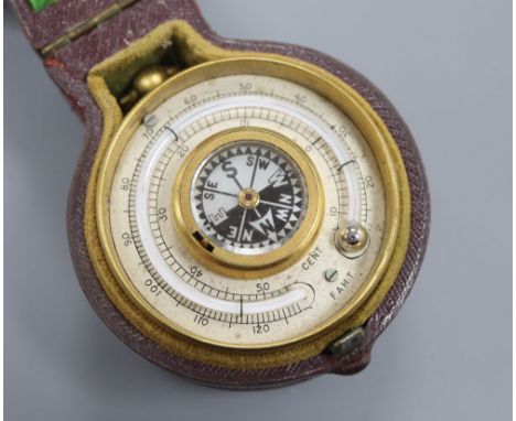 A late Victorian brass travelling barometer, thermometer and compass, cased
