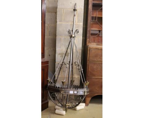 A Victorian steel and brass Gothic style chandelier, with conical brass sconces, drop 174cm, diameter 69cm