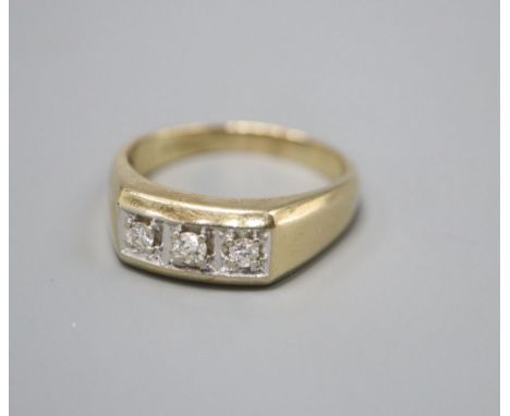 A 9ct. gold three stone diamond ring, larger than size Z, gross 7.3 grams