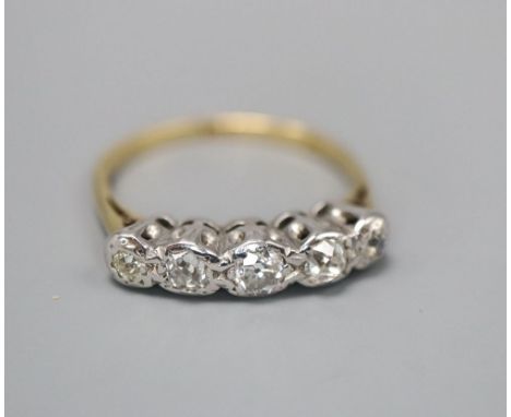 An 18ct and graduated illusion set five stone diamond half hoop ring, size L, gross 2.9 grams.CONDITION: Stone setting very w