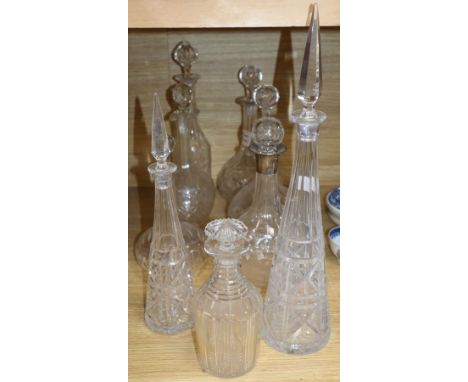 A silver collared decanter and eight other decanters, tallest 46cm incl. stopper
