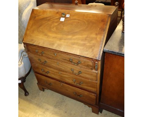 A George III mahogany bureau fitted four long drawers on bracket feet, W.86cm