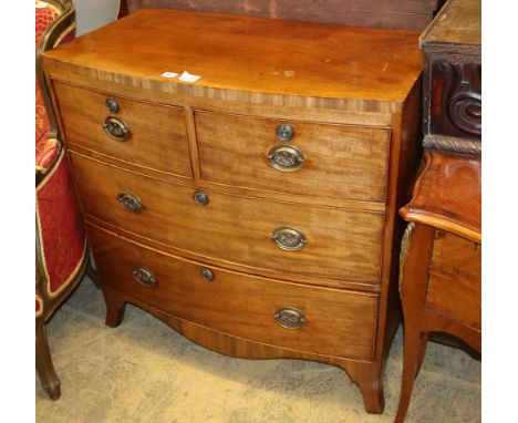 A Regency mahogany bow front chest of two short and two long drawers on splay bracket feet, W.90cm