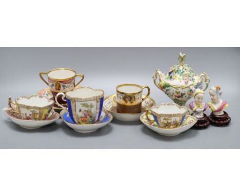 Four gilt decorated cabinet cups and saucers, a floral encrusted pot, height 15cm and two busts on stands