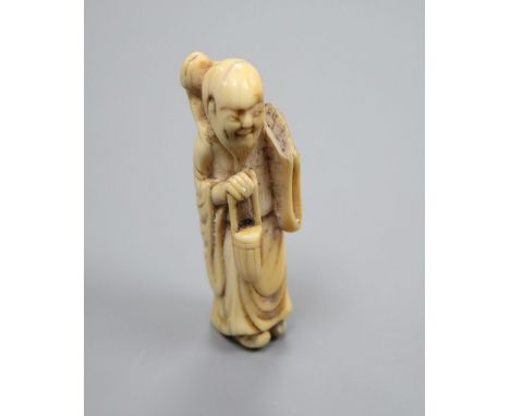 An 18th century Japanese netsuke of Gama Sennin, height 7cm