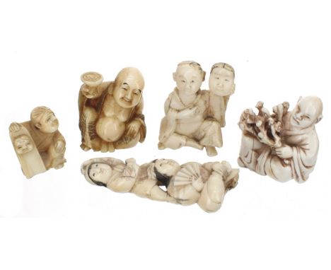 Five Japanese ivory netsuke modelled in various artistic and theatrical pursuits including two holding masks, Meiji period (5