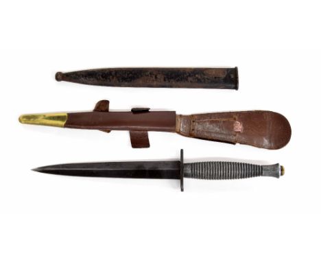 World War II Military Commando dagger, within leather and brass mounted scabbard; together with an associated metal scabbard,