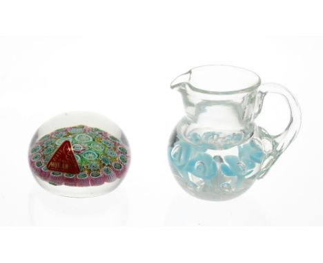 Joe St. Clair glass paperweight, in the form of a jug with bubble and turquoise petal inclusions, 3" high, together with a Mu