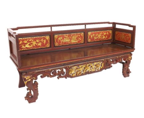 Decorative Chinese red lacquered day bed, the raised back fitted with five panels gilded in relief with vases of flowers, ove