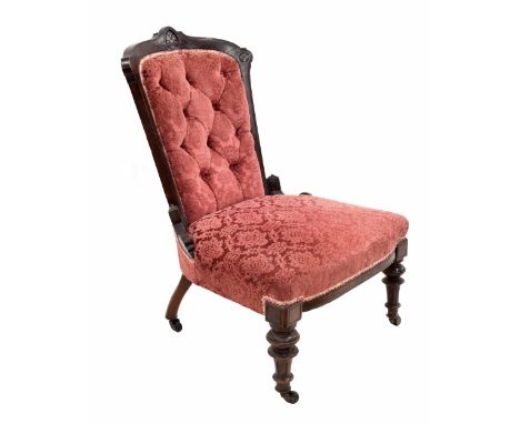 Late Victorian button-back upholstered nursing chair with scratch carving upon turned fluted front supports, 35" high