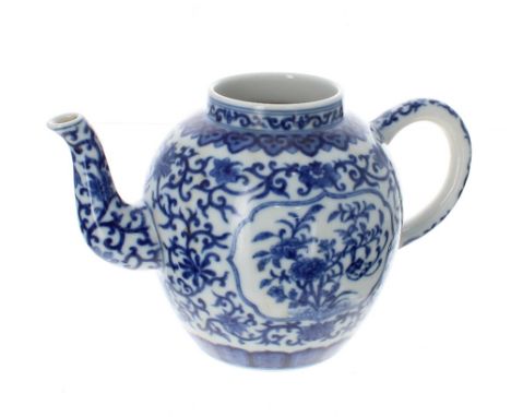 Chinese blue and white porcelain teapot, decorated with floral panels within scrolling foliage, bearing Daoguang marks 5" hig