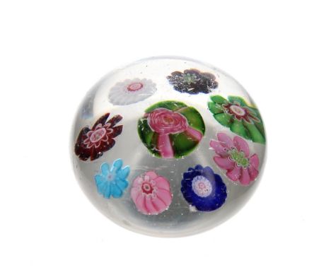 Miniature glass and millefiori paperweight probably Clichy, with multicoloured short canes around a central typical Clichy ro