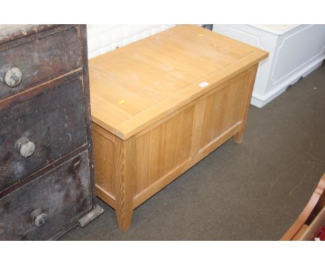 A light oak storage box