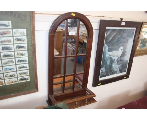 An arch framed sectional mirror