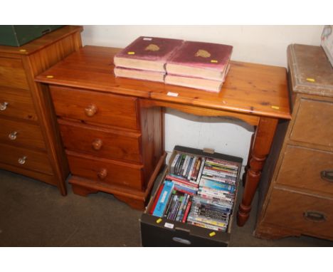 A pine kneehole desk fitted three drawers