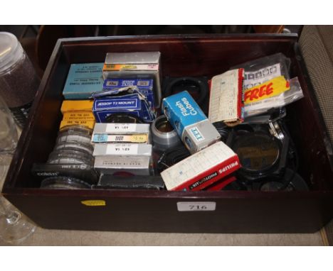 A box of various camera accessories