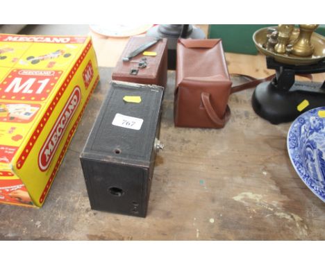 A Brownie box camera and one other