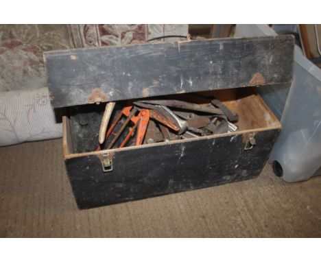 A wooden box and contents of various tools