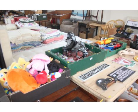 Three boxes of various toys and a pair of roller skates 