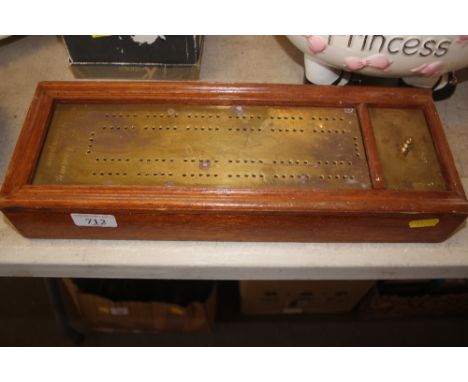 A brass mounted cribbage board