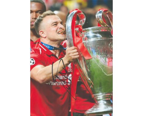 Football, Xherdan Shaqiri signed 12x8 colour photograph pictured as he celebrates with the Champions League Trophy. Shaqiri i