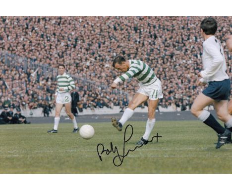 Autographed BOBBY LENNOX 12 x 8 photo - Col, depicting the Celtic midfielder having a pop at goal during a friendly encounter