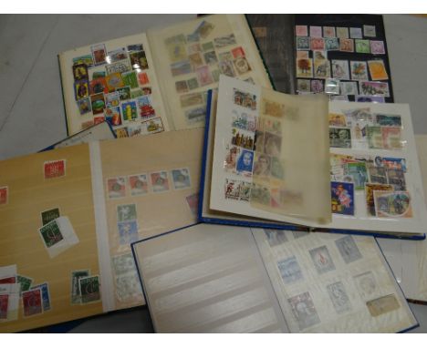 A parcel of seven vintage stamp albums containing British, Commonwealth &amp; Eastern European stamps