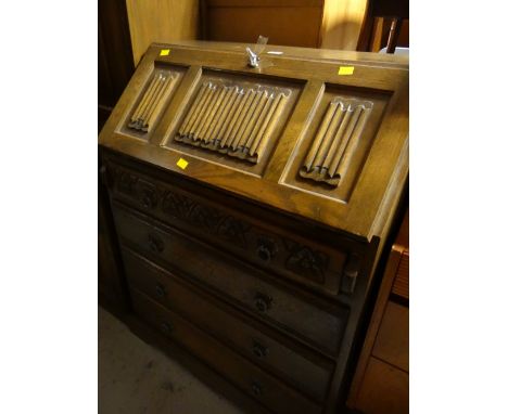 A vintage oak Old Charm four-drawer bureau
