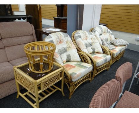 A bamboo & cane framed conservatory-style suite comprising two-seater sofa, two arm chairs, two matching tables together with