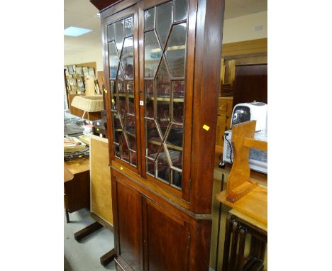 An antique mahogany standing corner cupboard with astragal glazed four-shelf top & two-door cupboard base