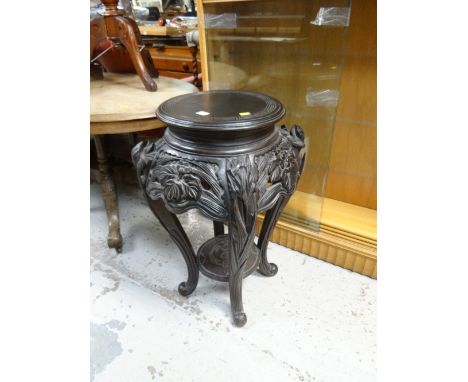 A Chinese carved hardwood planter stand