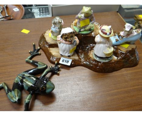 A Beswick / Doulton Beatrix Potter five-piece figure set on a wooden log effect base together with a ceramic frog