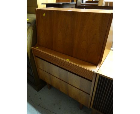 A vintage compact pull down three-drawer bureau