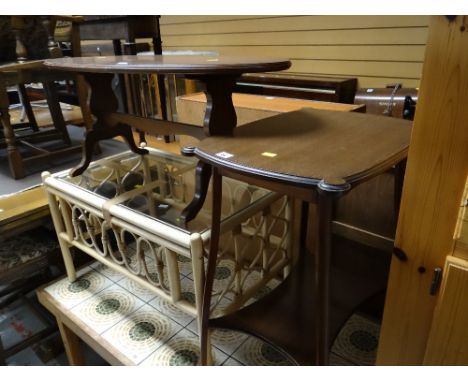 A vintage shaped top dark wood side table with lower shelf together with a modern oval top coffee table