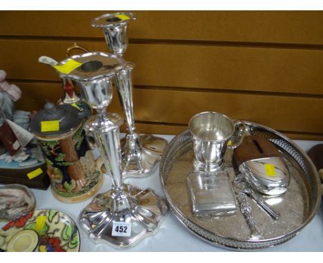 A parcel of EPNS including a pair of Walker & Hall EPNS tall candlesticks, circular tray, hip flask etc