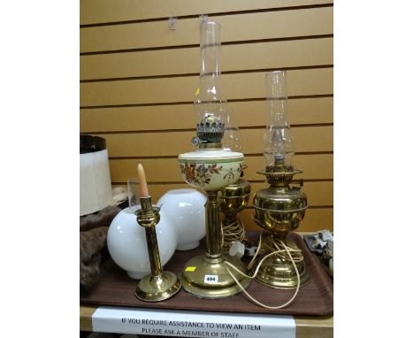 Brass columned, glass painted reservoir oil lamp together with two others converted to electric lights etc E/T